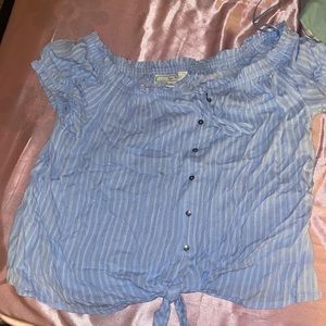 Light blue and white top with buttons